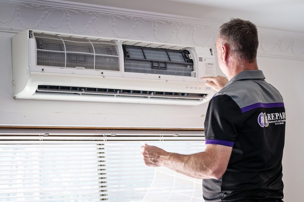 indoor air handler of a split system being installed in a living room