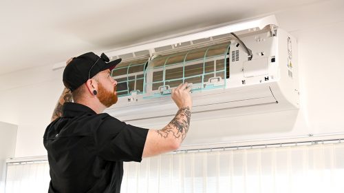 A REPARE technician testing a home switchboard while attending an emergency electrician in Loganholme call out.