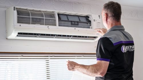 indoor air handler of a split system being installed in a living room