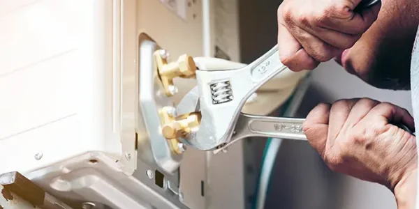 technician-hand-using-fix-wrench